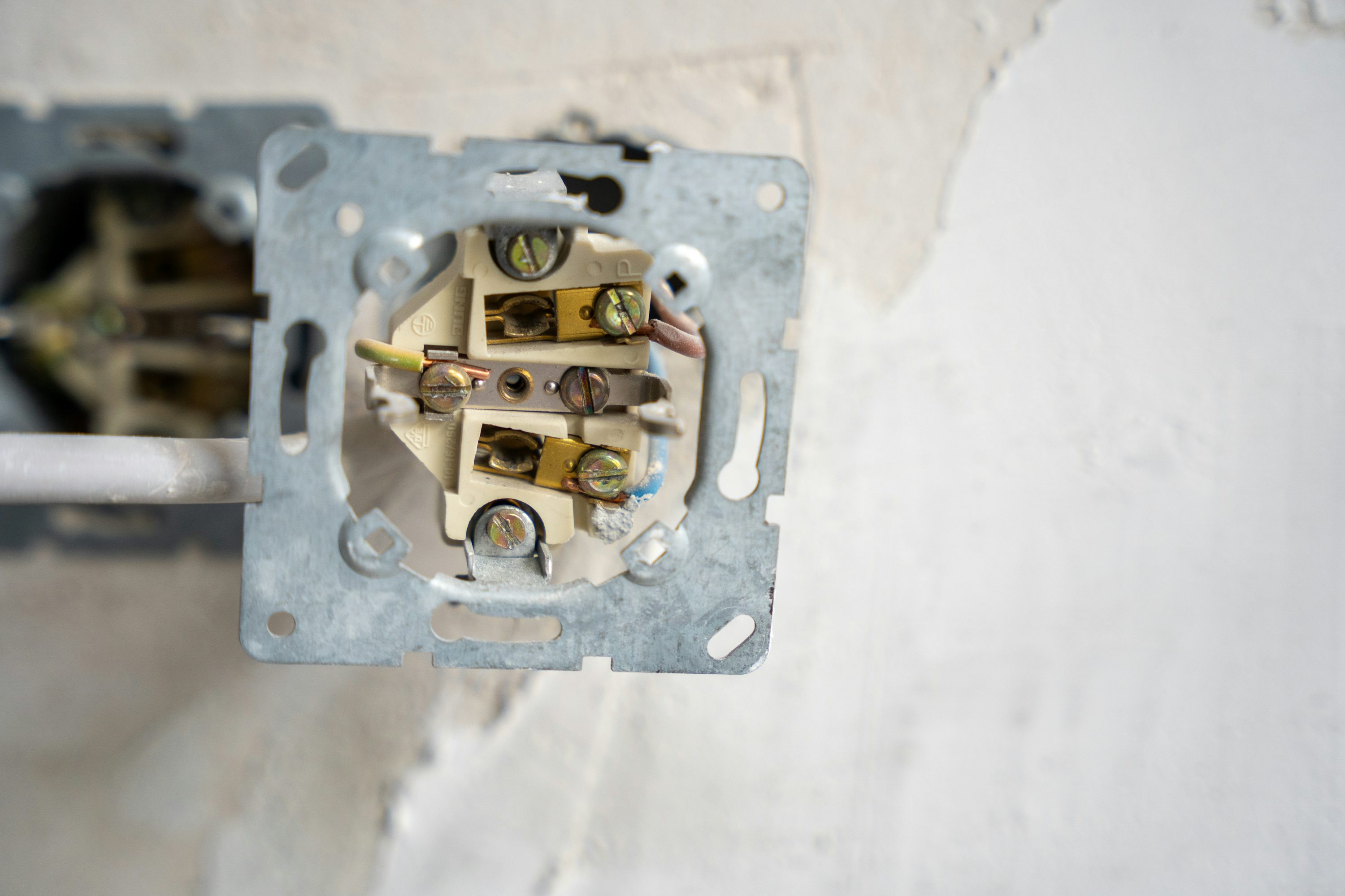 Exposed outlet wiring during electrical work